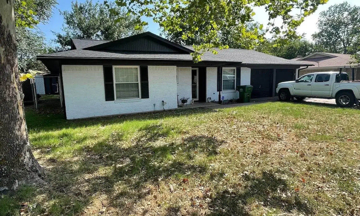 Professional roofing crew working on a residential roof in Lafayette